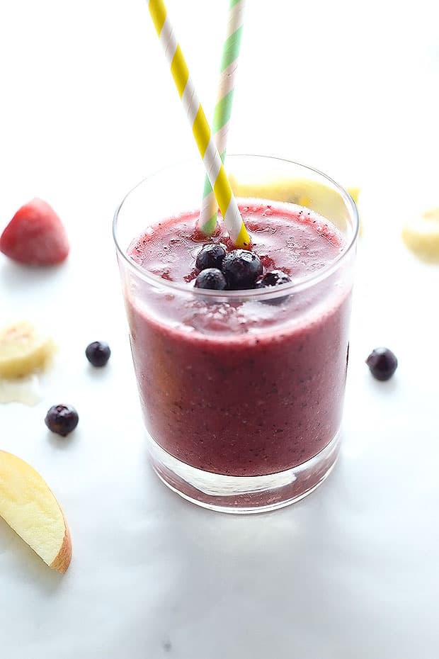 this Blueberry Elixir Smoothie is packed with blueberries, apples, bananas and strawberries and blended with coconut water! perfect blend of nutritious and delicious! 