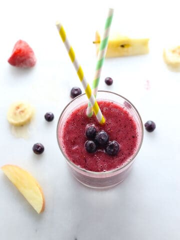 this Blueberry Elixir Smoothie is packed with blueberries, apples, bananas and strawberries and blended with coconut water! perfect blend of nutritious and delicious!