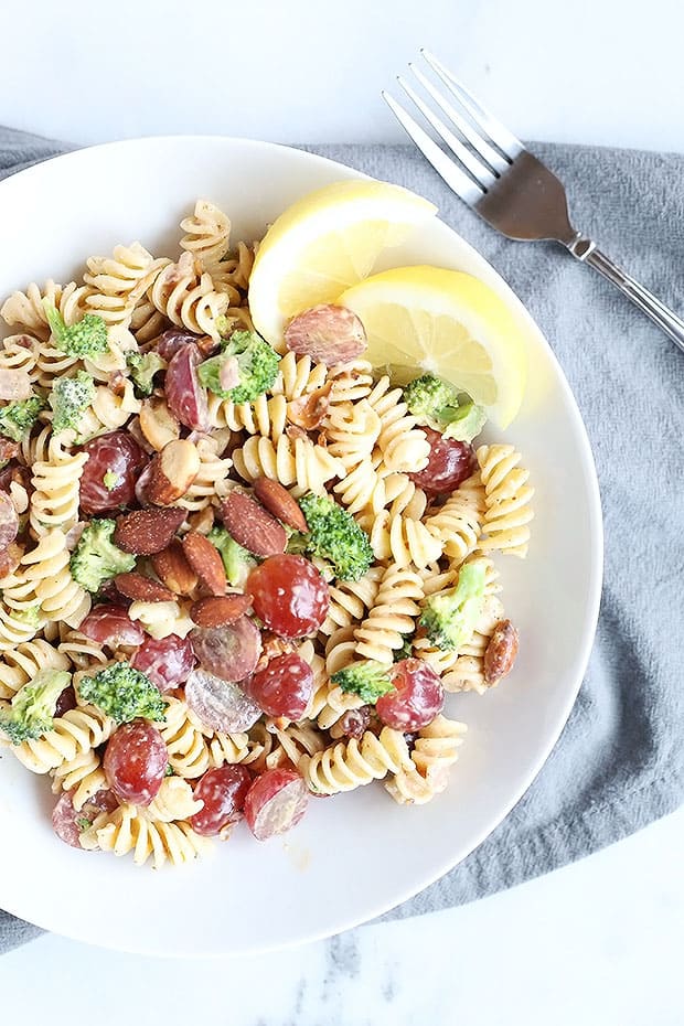 This 30 Minute Easy Broccoli Grape Pasta Salad is so quick and easy to prepare. Only takes 30 minutes and perfect for lunch, dinner, parties, or pic nicks. Vegan and Gluten free Option. / TwoRaspberries.com
