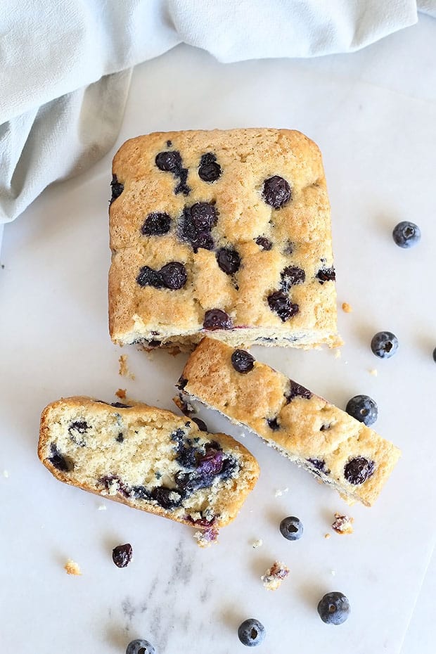 Soft, moist, and sweet! This Amazing Vegan Blueberry Loaf Bread is the BEST sweet treat. Just like a muffin but in the form of a loaf bread. Vegan. / TwoRaspberries.com