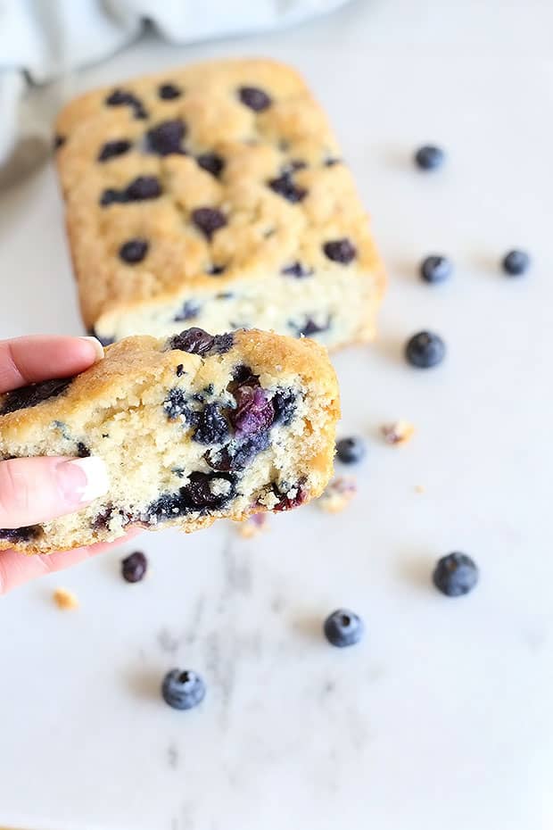 Soft, moist, and sweet! This Amazing Vegan Blueberry Loaf Bread is the BEST sweet treat. Just like a muffin but in the form of a loaf bread. Vegan. / TwoRaspberries.com