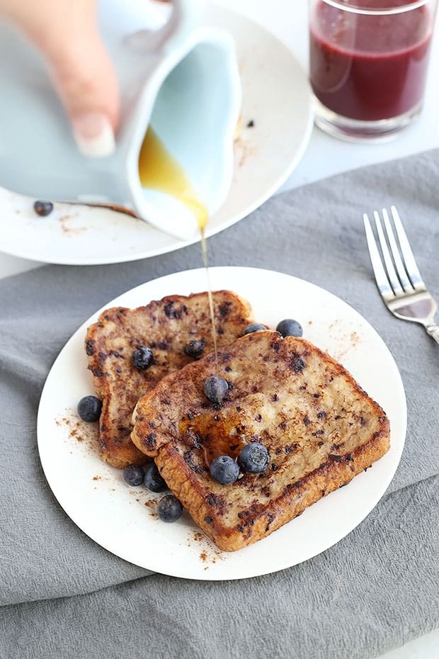 This Healthy Vegan Blueberry Banana French Toast is soft, moist and delicious! Blueberries and Bananas come together perfectly in this vegan french toast! / TwoRaspberries.com