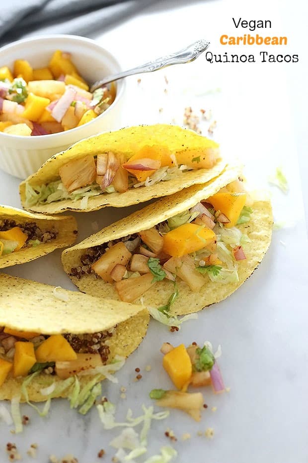 Vegan Caribbean Quinoa Tacos! Nutty quinoa meets fresh and spicy chili pineapple mango salsa in these tacos! These tacos are super quick and easy to make. Vegan and Gluten Free! / TwoRaspberries.com