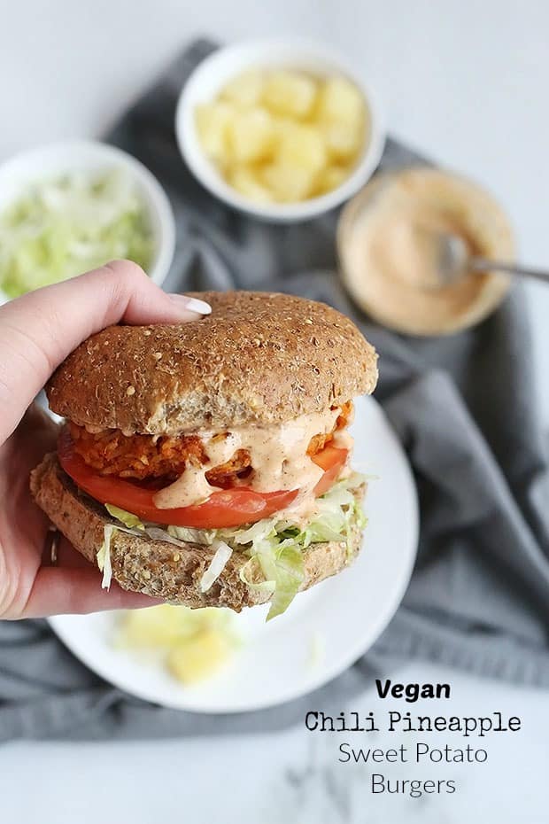 These Vegan Chili Pineapple Sweet Potato Burgers are FULL of flavor! sweet pineapple and spicy chili make an amazing combo. A chili flavored spread pairs perfectly with these burgers! Vegan and Gluten Free Option. / TwoRaspberries.com