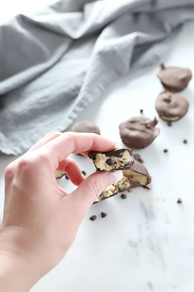  These Vegan Gluten Free Chocolate Cookie Dough Cups are a great treat! Super easy to make, and perfect for a chocolate or cookie craving! / TwoRaspberries.com