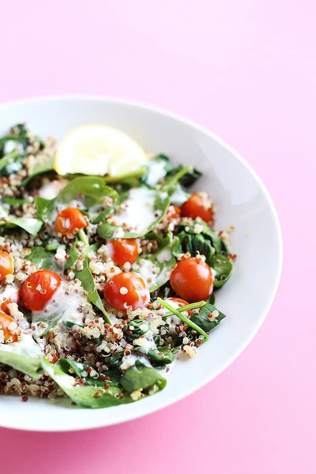This 5 Ingredient Tomato Spinach Quinoa Salad is healthy and light, great for lunch and ready in less than 30 minutes! Vegan and Gluten Free! / TwoRaspberries.com