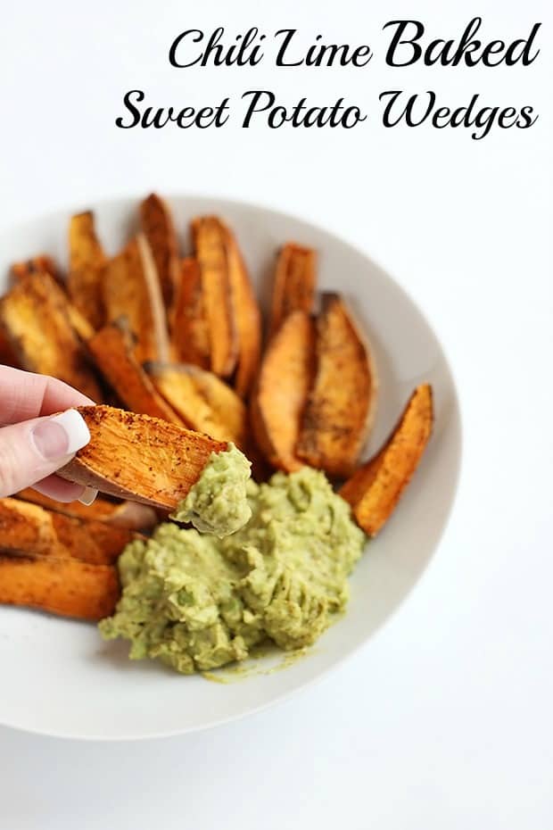 These Chili Lime Baked Sweet Potato Wedges are SUPER easy to make and the avocado lime dip is the perfect pairing for these wedges! Vegan and gluten free. / TwoRaspberries.com