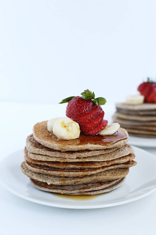 Strawberry Banana Oat Pancakes are full of fiber from the oat’s healthy and easy to make! They are naturally sweetened, vegan and gluten free./ TwoRaspberries.com
