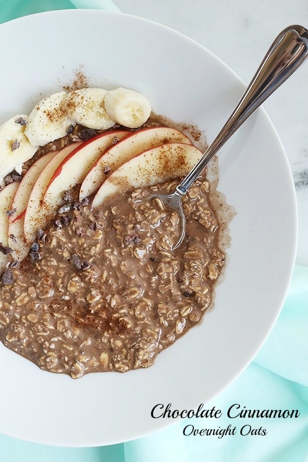 Chocolate Cinnamon Overnight Oats are an easy go-to for anyone in a hurry! Chocolate and cinnamon topped with apples and bananas are a perfect combo! Vegan / TwoRaspberries.com