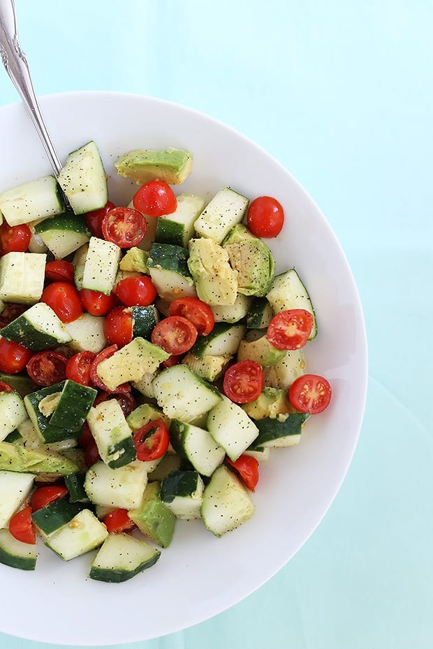  This Healthy Tomato Avocado Cucumber Salad is quick and easy to prepare, healthy, and has two different dressing options, smoky or sweet. Vegan. / TwoRaspberries.com