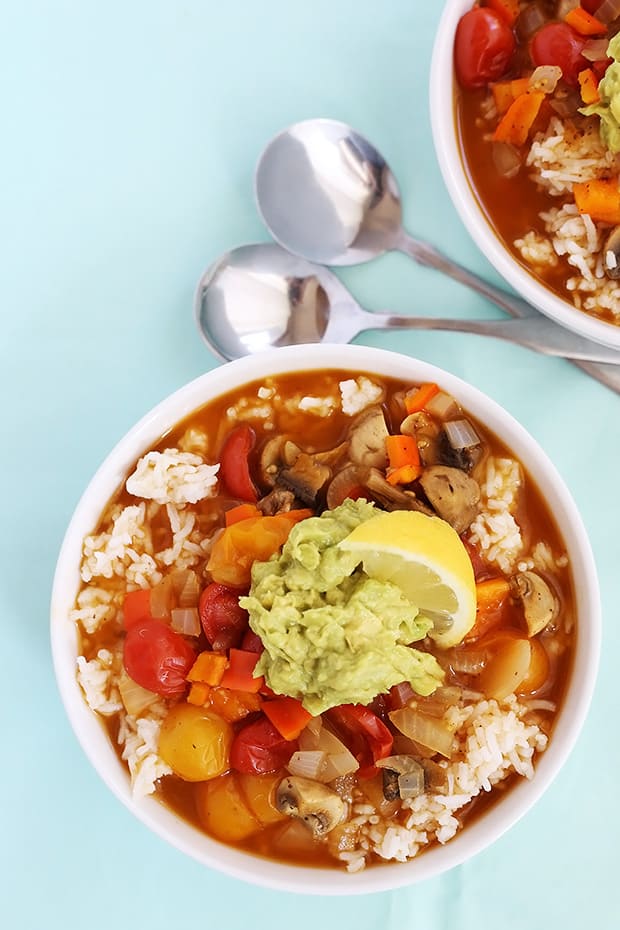  Mushroom Veggie Rice Soup is a warm and comforting dish that’s really easy to make. It is oil free and low sodium, vegan and gluten free! / TwoRaspberries.com