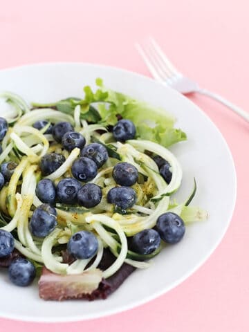 This Healthy Cucumber Noodle Blueberry Salad is fresh, light and has a sweet and savory maple and mustard dressing! Vegan and GF. / TwoRaspberries.com