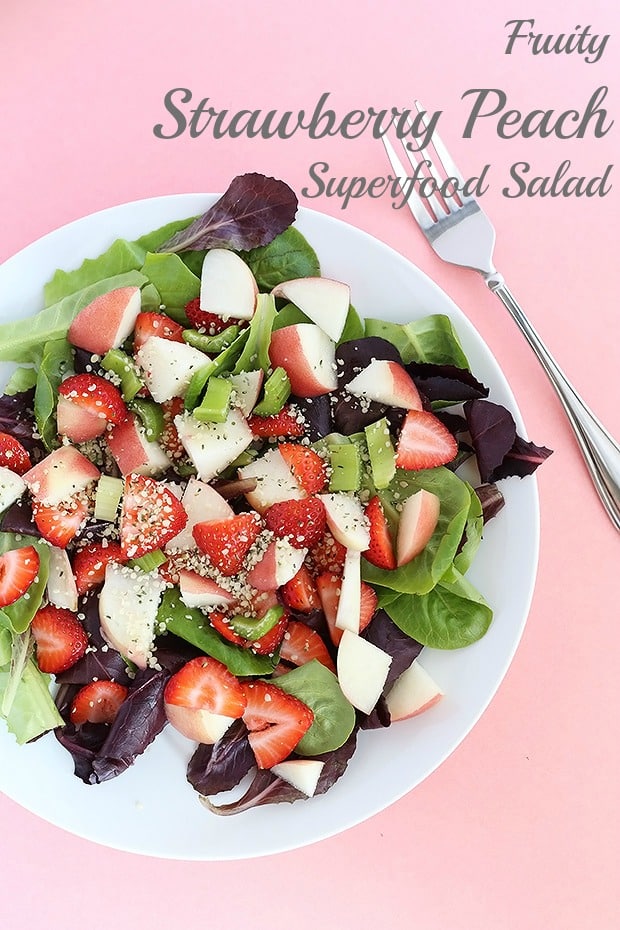  This Fruity Strawberry Peach Superfood Salad is fresh and packed FULL of vitamins and minerals! Light and oil free with optional lemon maple dressing. Vegan RAW and GF / TwoRaspberries.com