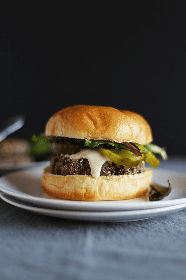 These 5 Ingredient Garlic Onion Black Bean Burgers are SO easy to make, paired with a tahini lime sauce, healthy, VEGAN and GF! | TwoRaspberries.com