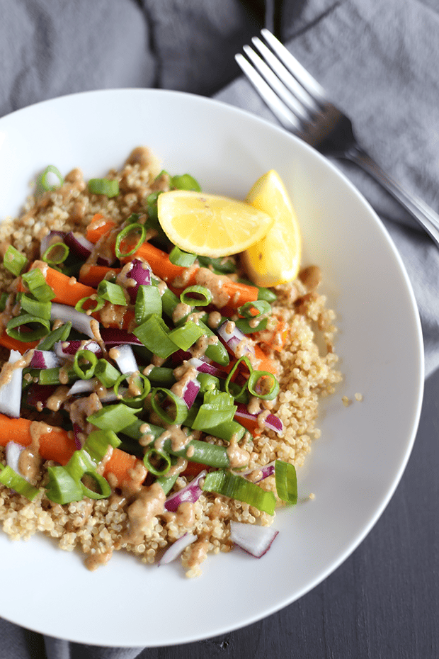 This Clean Protein Quinoa Bowl is packed with healthy protein and ingredients like carrots, green beans, onions and sweet almond maple dressing! Vegan - GF | TwoRaspberries.com