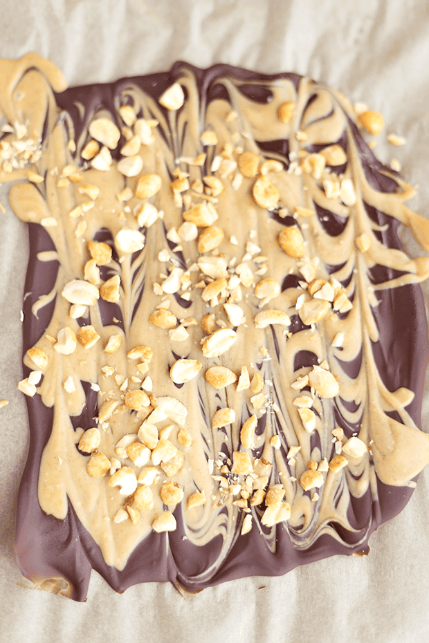 This Easy Peanut Butter Chocolate Bark with extra peanut chunks is SO rich and indulgent. Quick and easy to make, requires 3 simple ingredients, vegan + GF! | TwoRaspberries.com