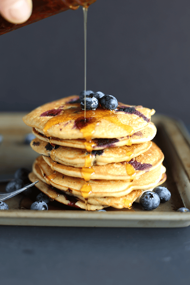 These Healthy Blueberry Pancakes are super easy to make, packed with fresh blueberries! Super soft and light textured, refined sugar free, vegan and gluten free. | TwoRaspberries.com