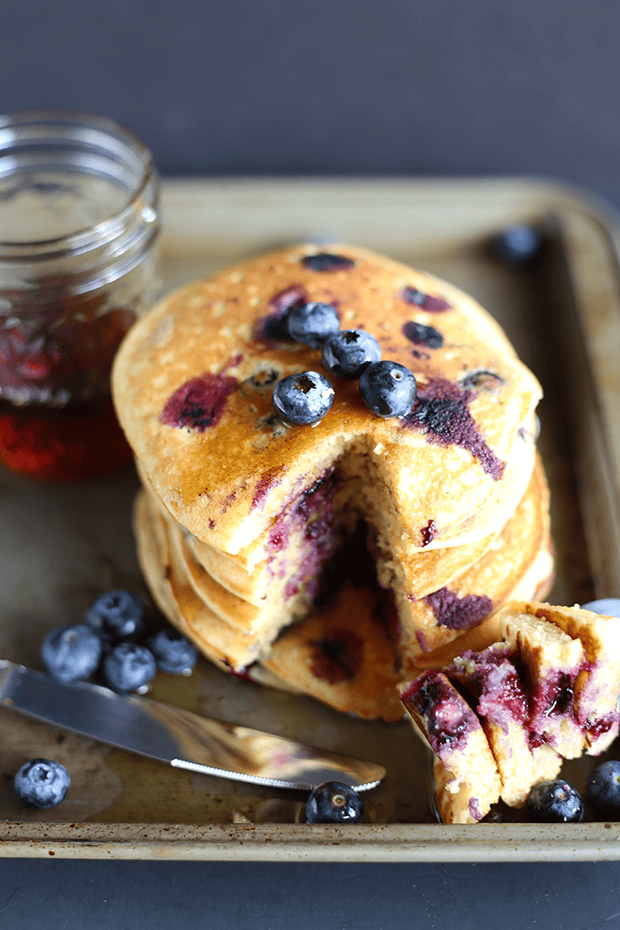 These Healthy Blueberry Pancakes are super easy to make, packed with fresh blueberries! Super soft and light textured, refined sugar free, vegan and gluten free. | TwoRaspberries.com