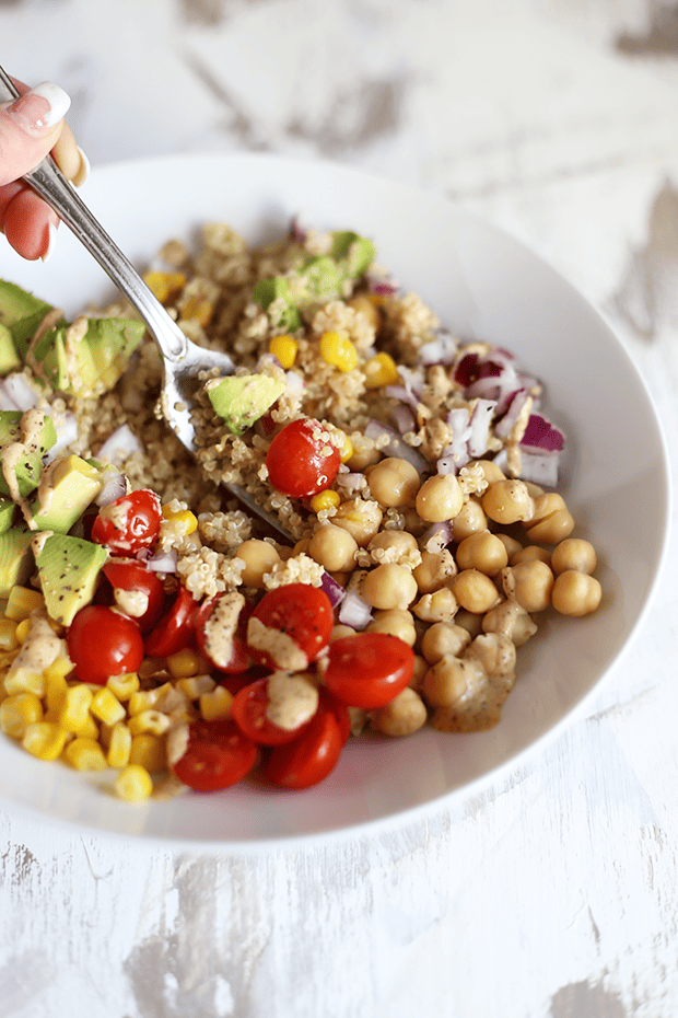 Healthy Quinoa Burrito Bowl with Spicy Tahini Sauce! quick + easy to make. Perfect for meal prepping, packed with protein, Vegan, GF and Oil Free. | TwoRaspberries.com