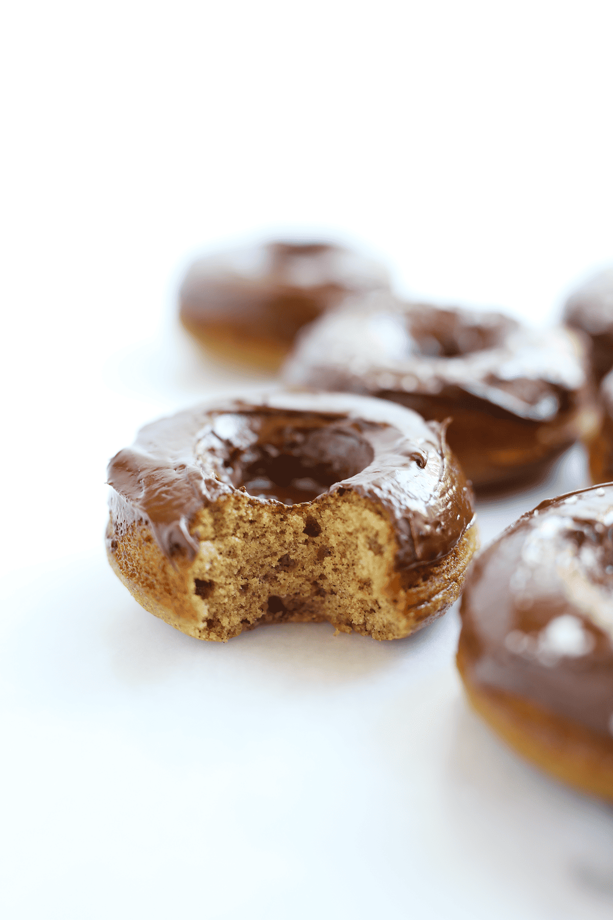 These Chocolate Frosted Cinnamon Donuts are super light and moist in the center with a rich chocolate frosted top, only require 1 bowl and vegan or course!