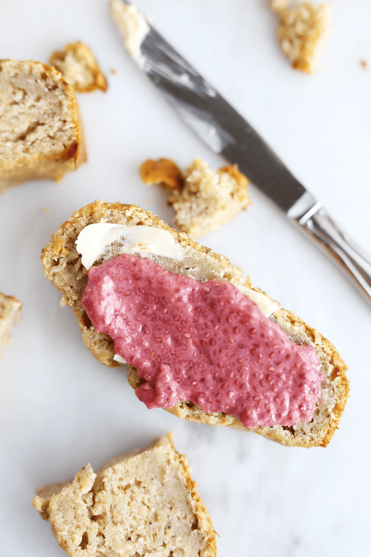 This easy basic Banana Bread is super dense, moist and soft, naturally sweetened with pure maple syrup and vegan! Topped with Strawberry Chia Jam! 