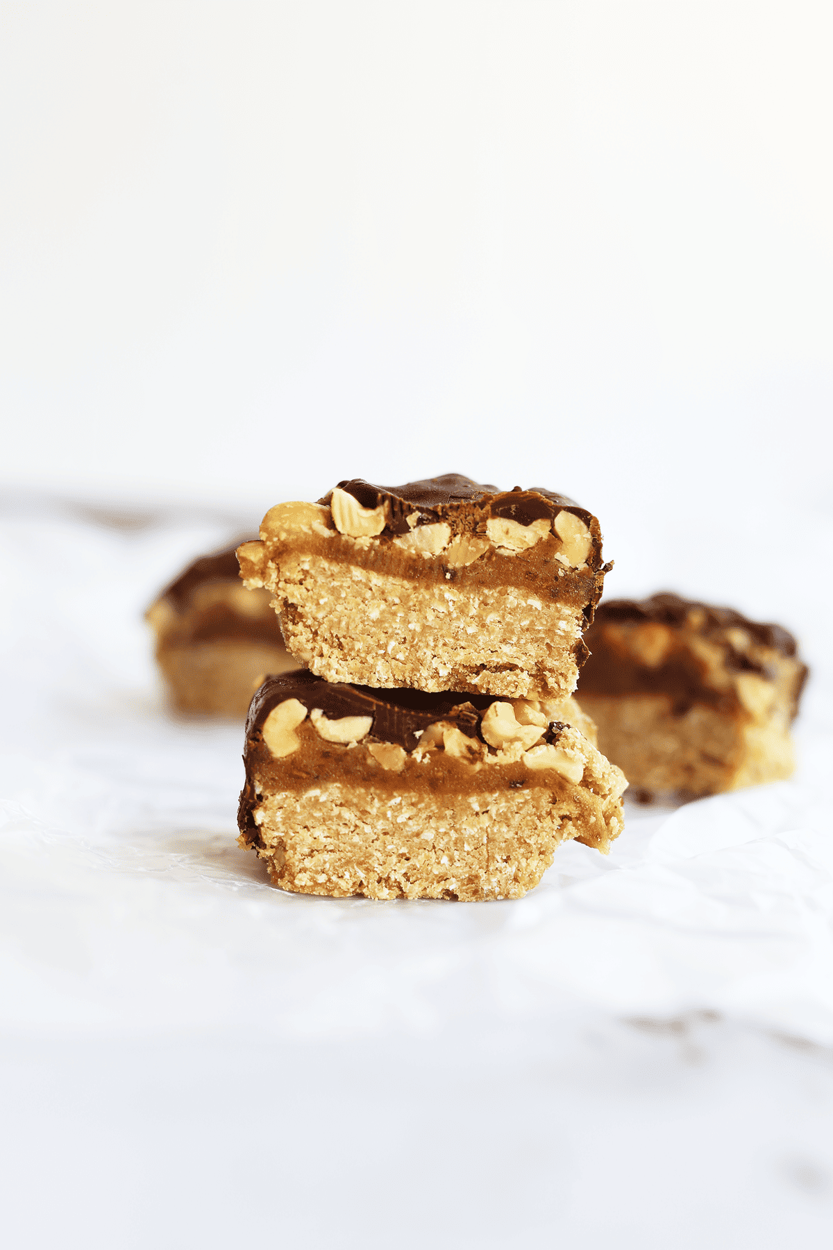 These Chocolate Caramel Peanut Butter Bars taste just like a homemade snickers! They’re also vegan, gluten free, refined sugar free and no baking required. 