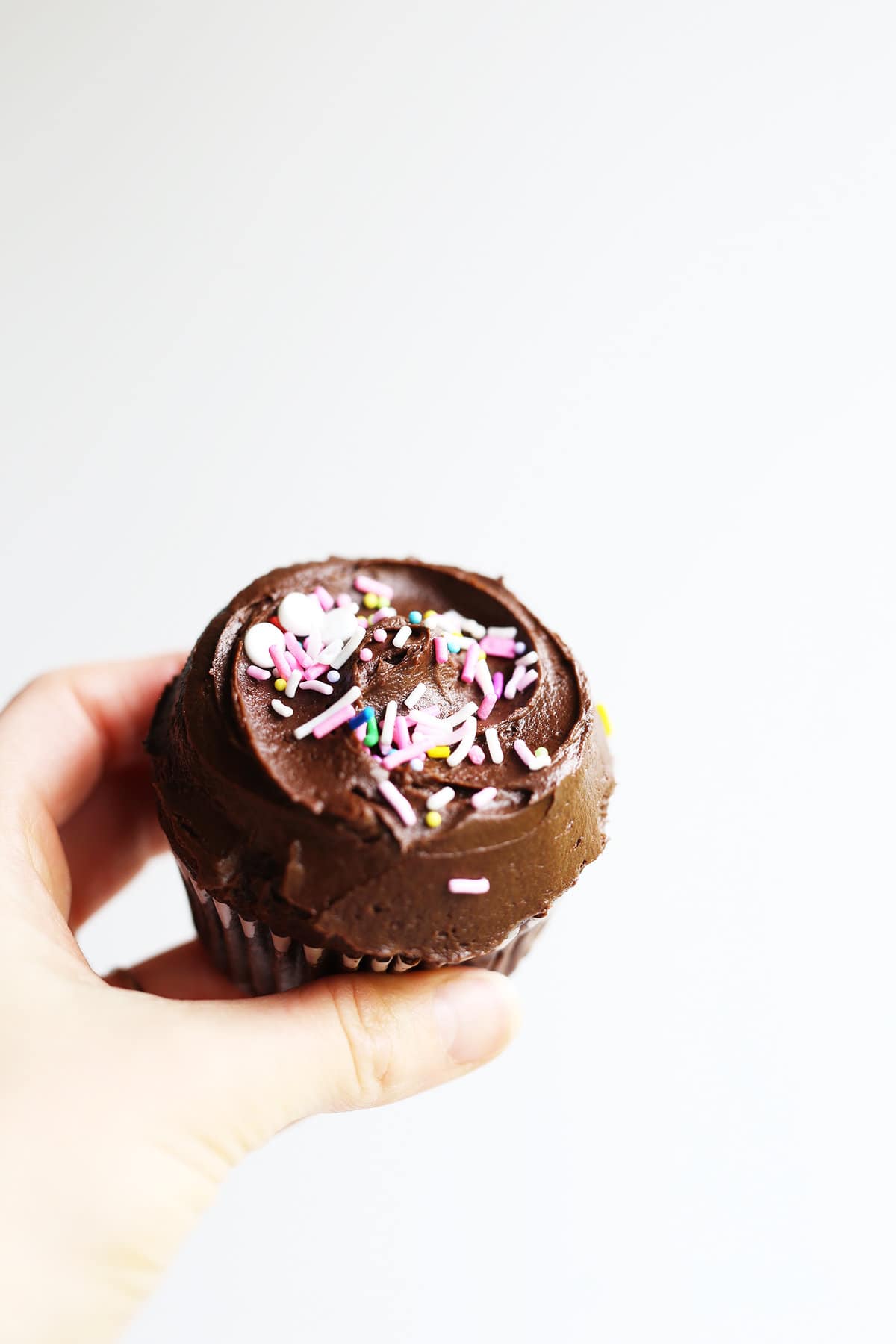 These Chocolate Birthday Cupcakes are the best, soft + moist, indulgent cupcakes ever! Vegan and sweet, easy to make and topped with fun sprinkles.