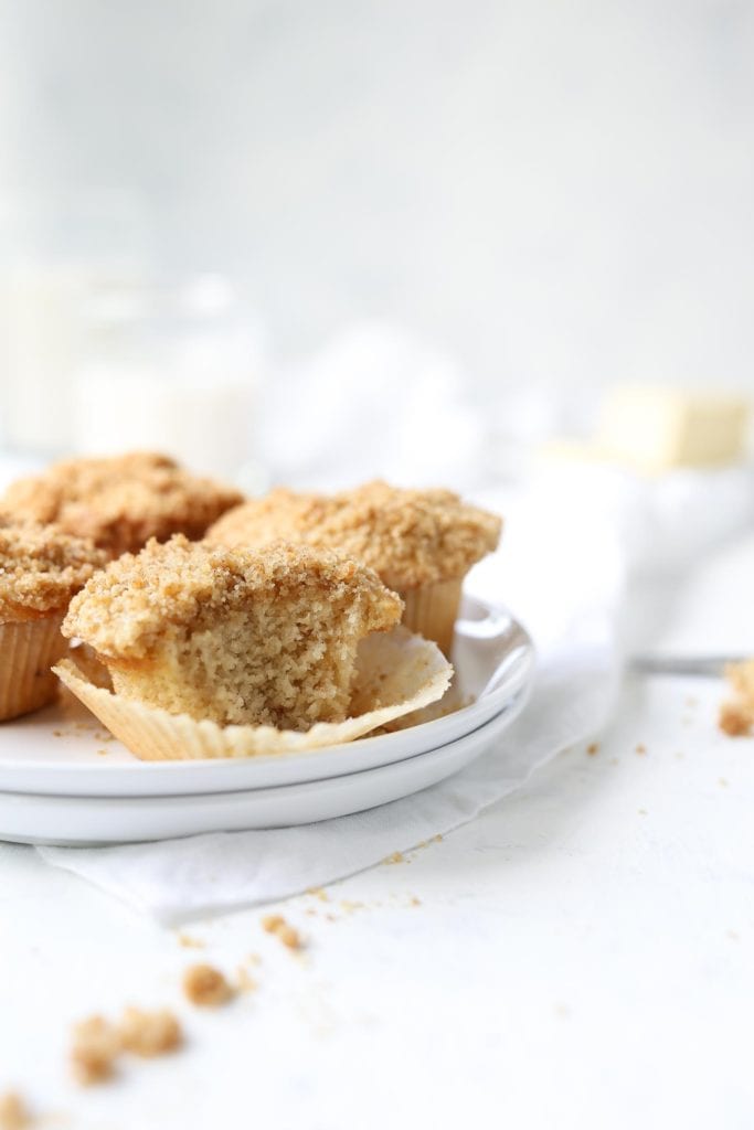 vegan apple cider muffin recipe with streusel topping on white plates