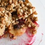 apple and blackberry crumble in pie dish