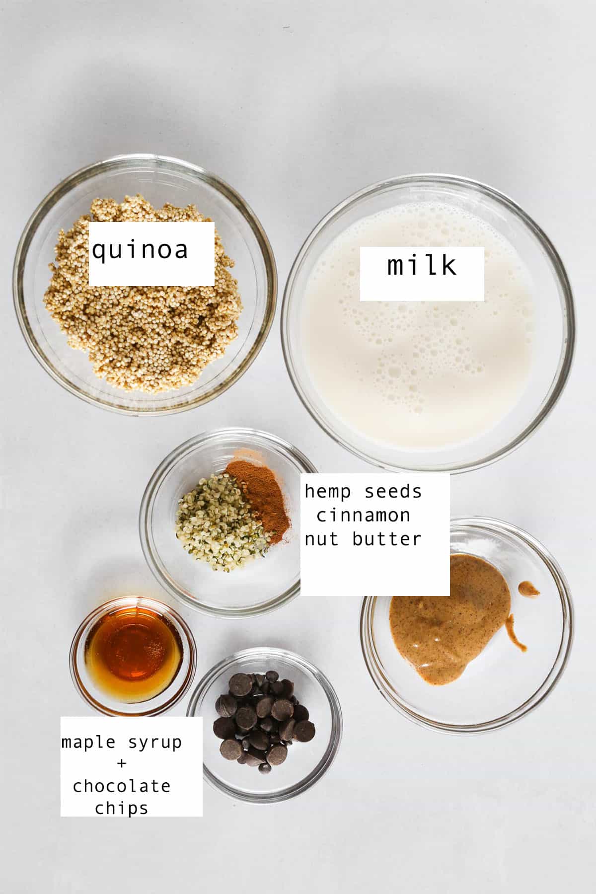 Ingredients to make a quinoa bowl for breakfast on the counter with text labels before mixing.
