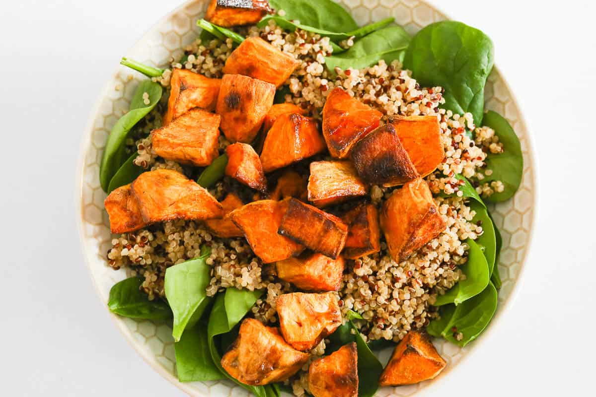 Roasted sweet potato on top of the quinoa and spinach.