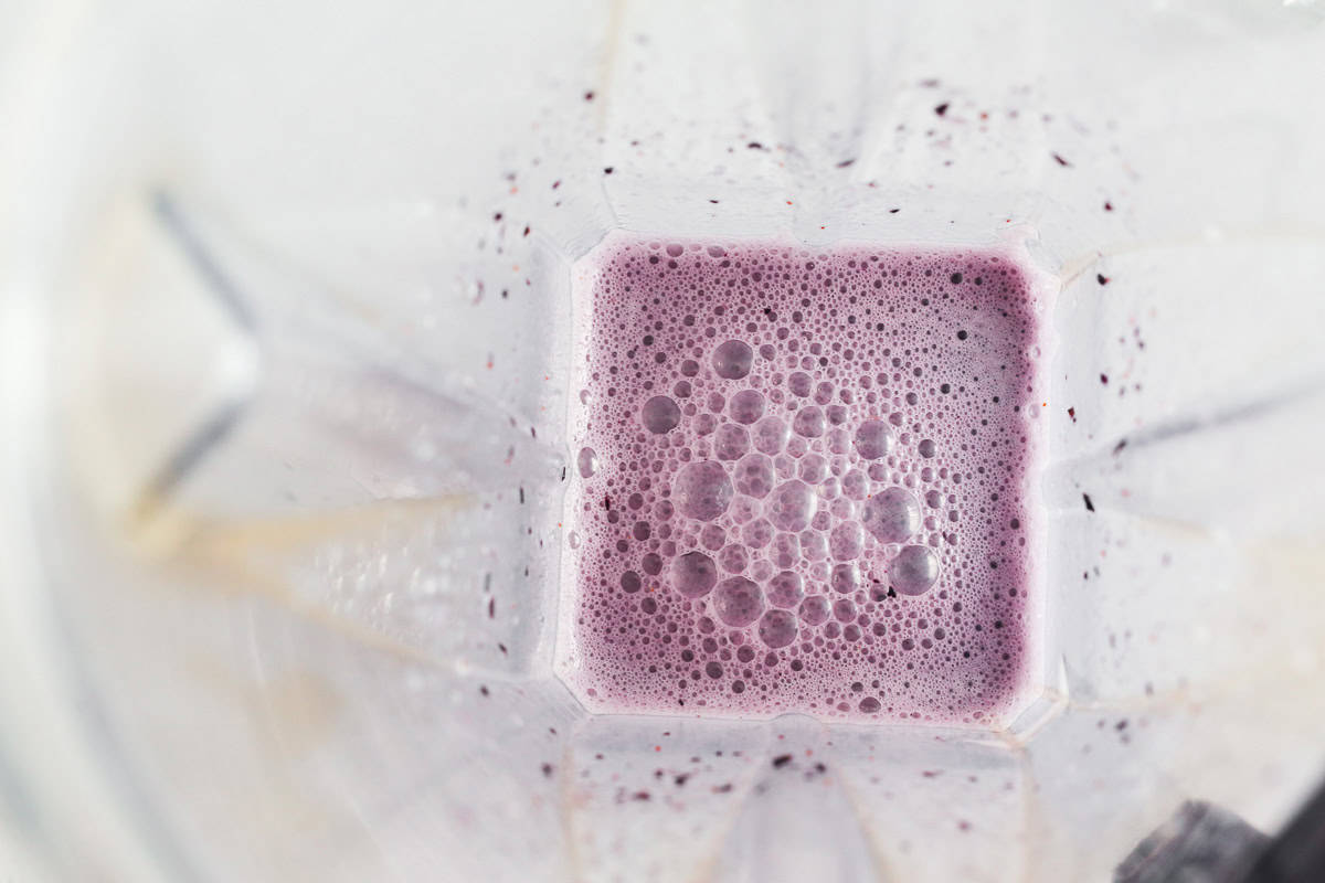 Blueberries blended with milk.