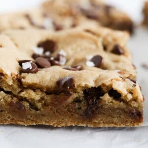 1200 x 1200 close up side view of Chocolate Chip Cookie Bars.