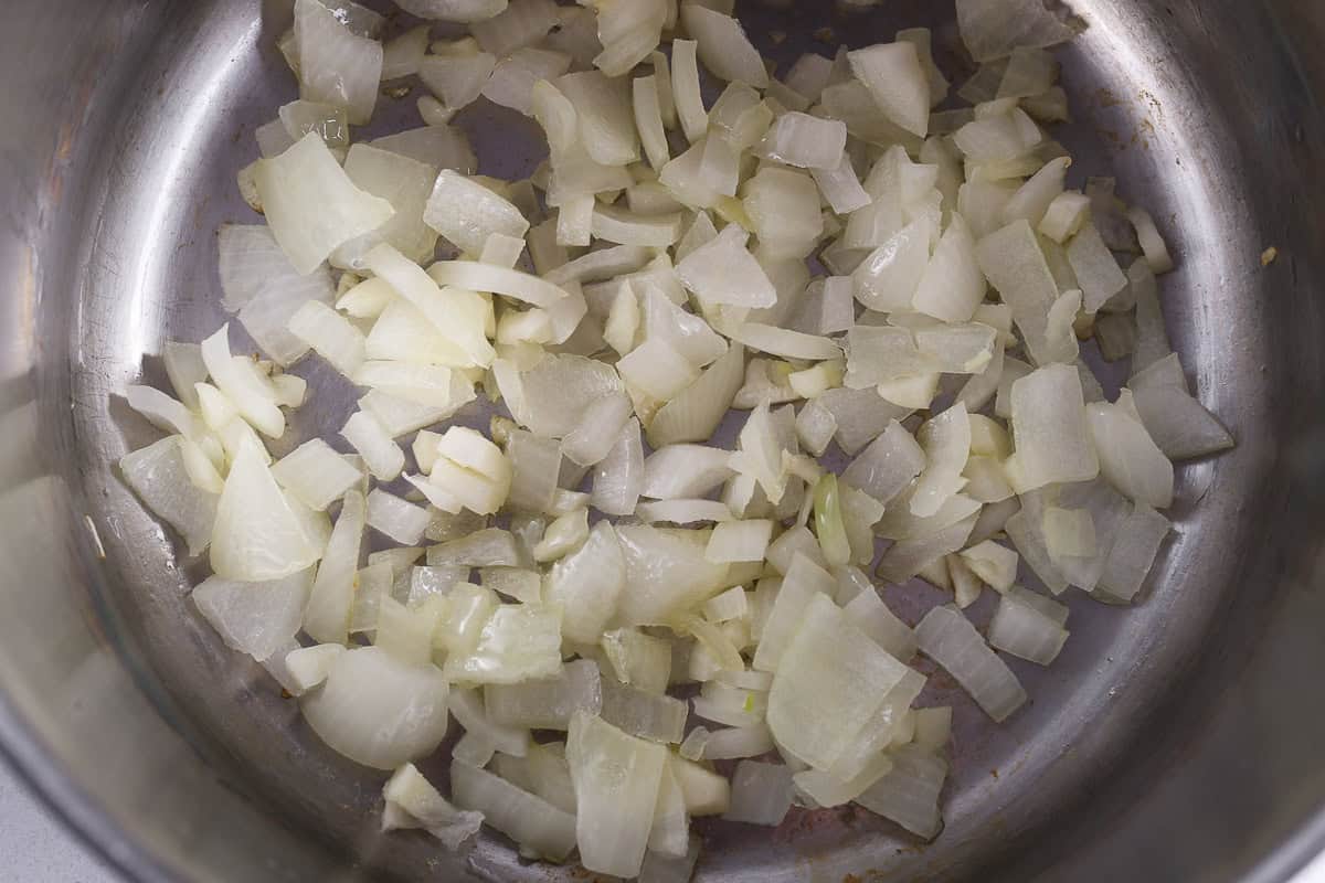 Pot with sauteed onion and garlic.