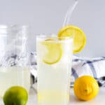 1200 x 1200 image Lemon Lime Spritzer with lemon garnish in a tall clear glass jar with a straw.