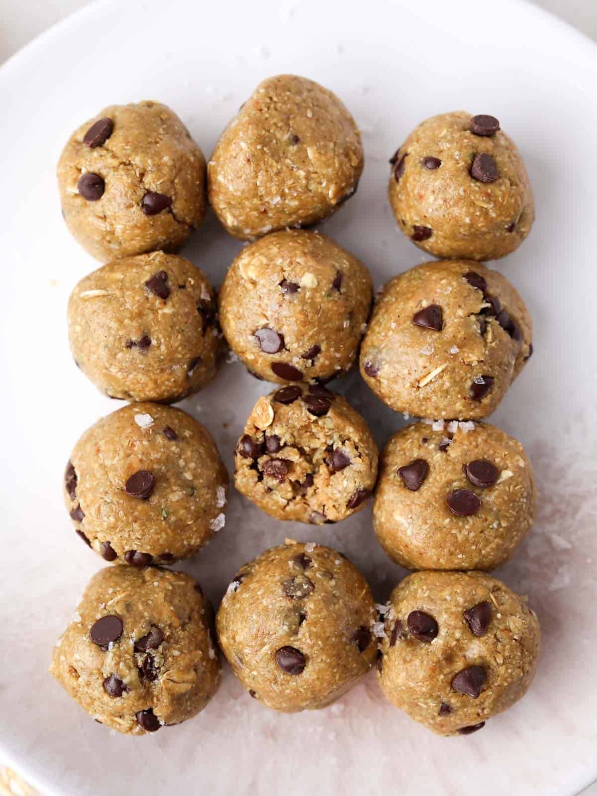 Close up image of peanut butter and chocolate protein balls on a plate.