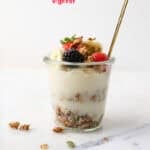 Pinterest image with text of this parfait with granola and yogurt.