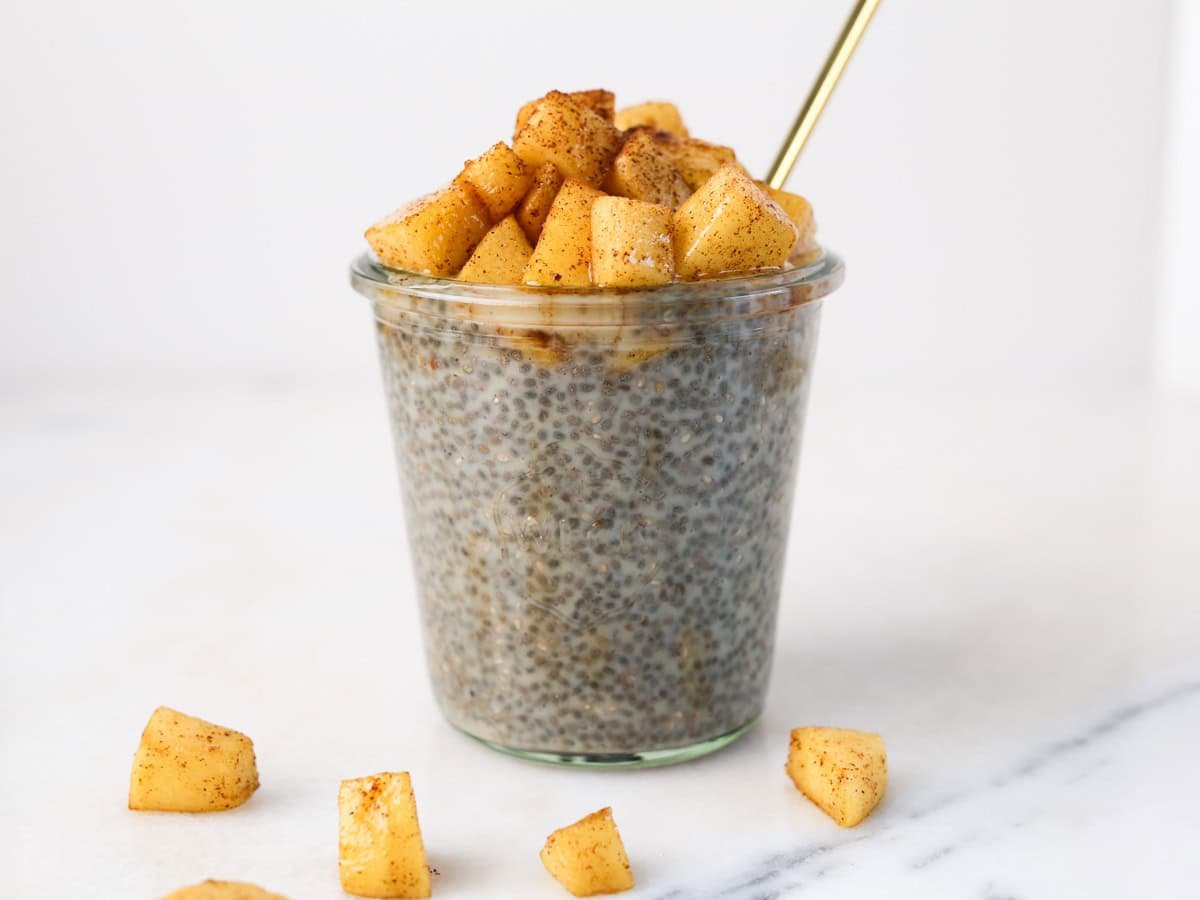 Glass jar with apple chia pudding.