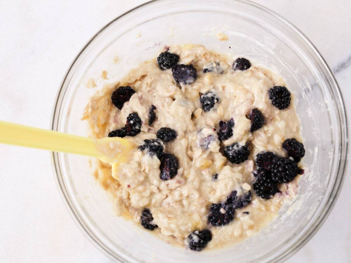 Blackberries being folded into the dairy free muffin batter.