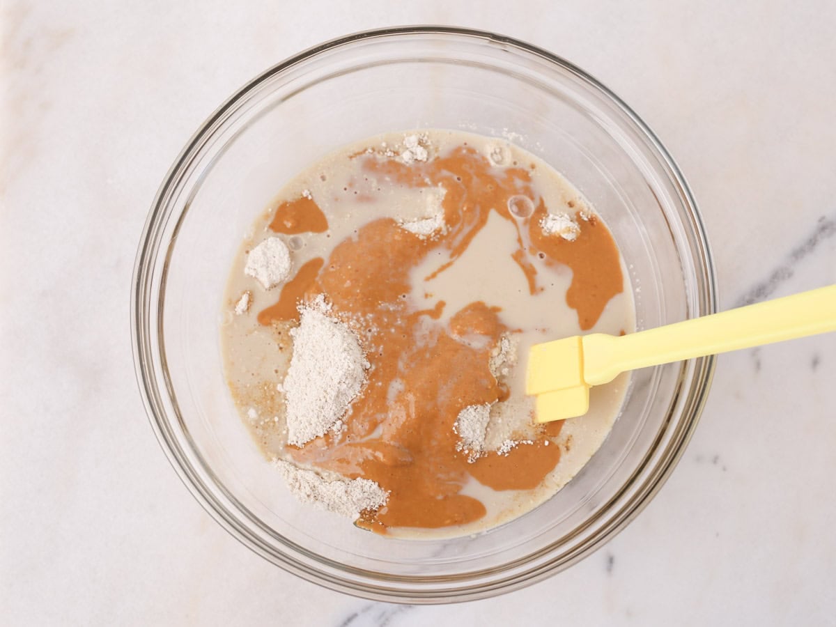 Ingredients in glass bowl to make healthy vegan cookie dough.