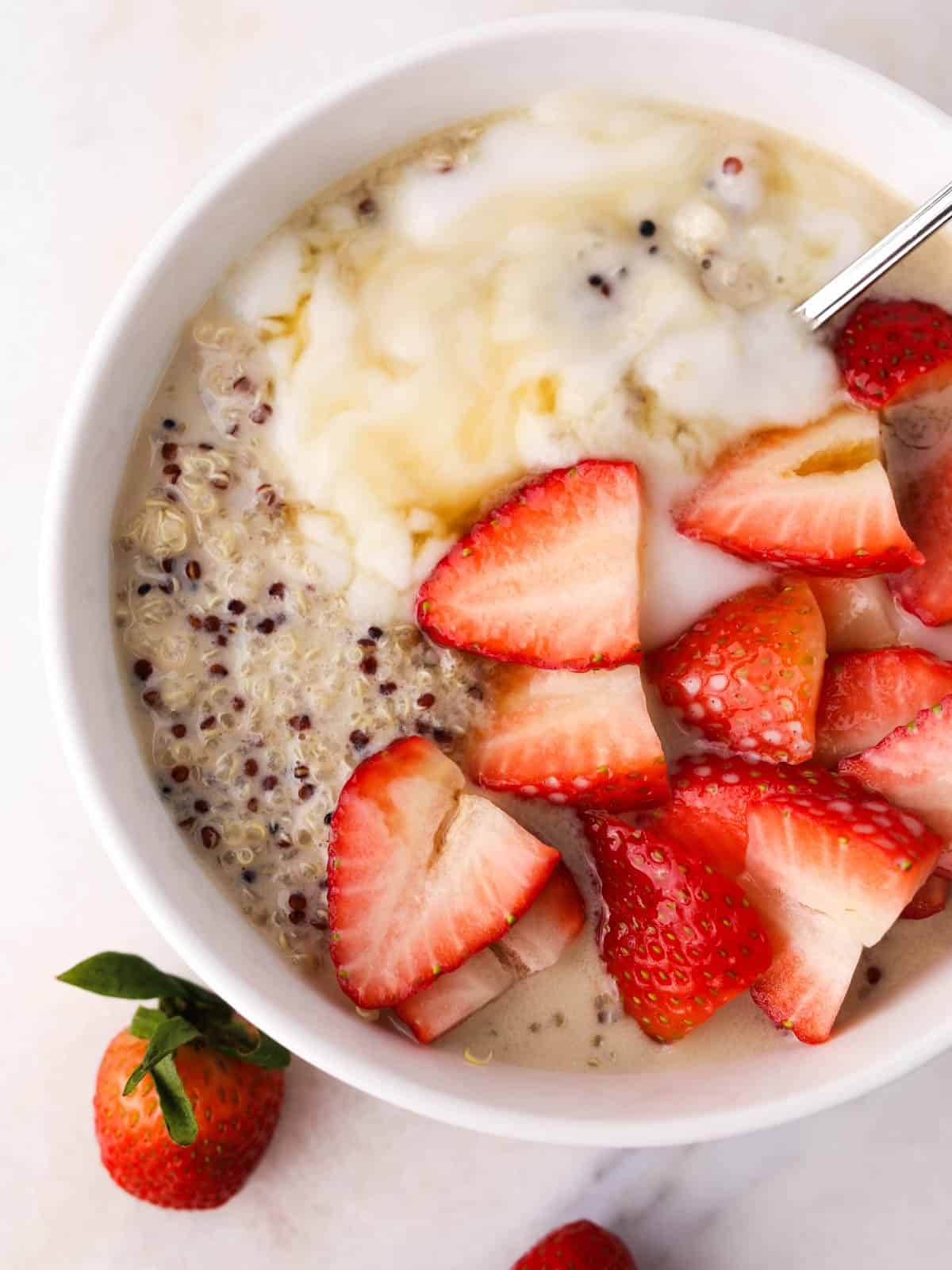 Close up overhead image of this Quinoa Breakfast Bowl Strawberries and Cream in a bowl.
