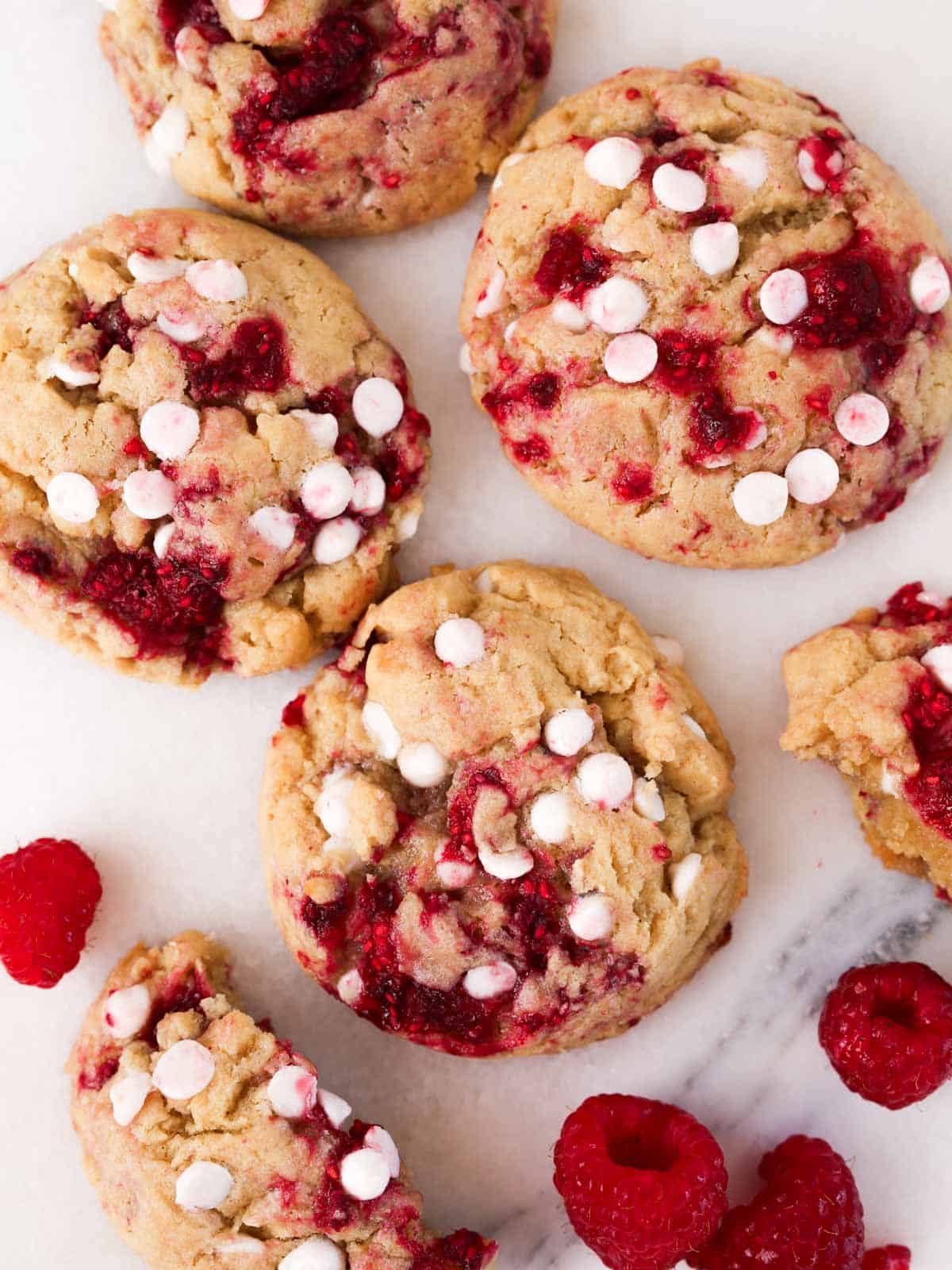 Overhead image of multiple white chocolate raspberry cookies.