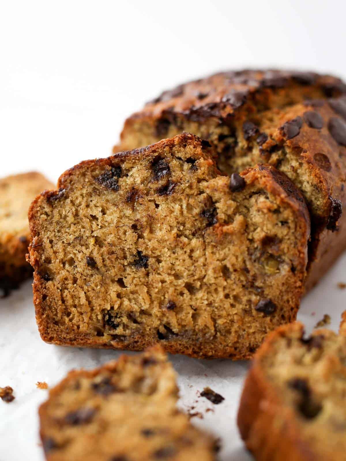 Banana chocolate chip loaf side image of it sliced into.