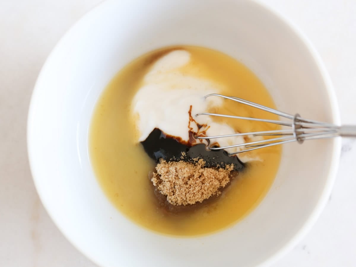 Wet ingredients in mixing bowl with whisk.