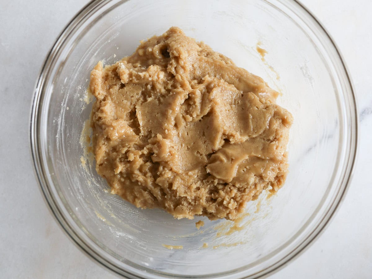 Cookie dough in glass bowl.