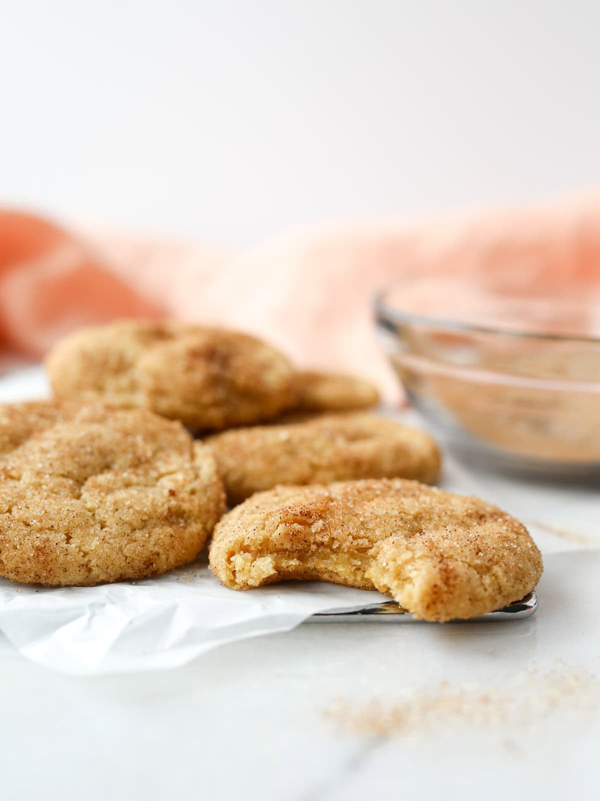 Close up of bite taken out of these vegan snickerdoodles.