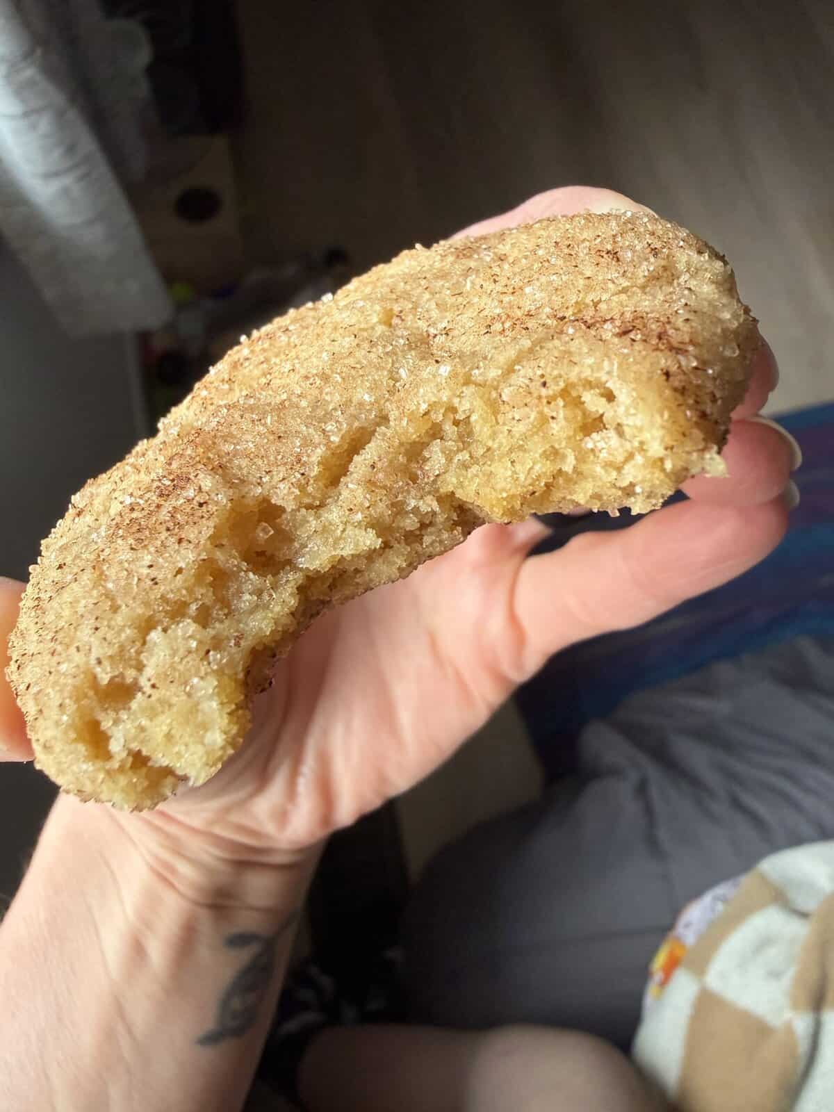 Bite shot with iPhone vegan snickerdoodle.